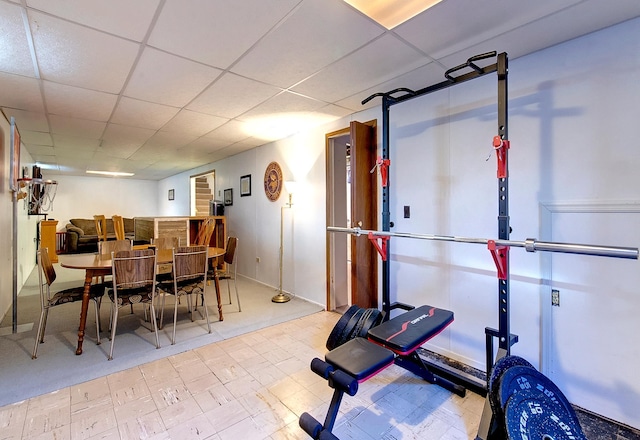 exercise room featuring a drop ceiling