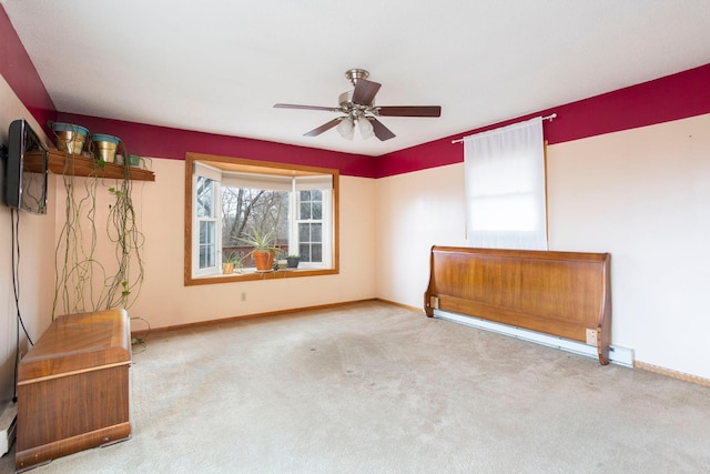 unfurnished room with ceiling fan and carpet flooring