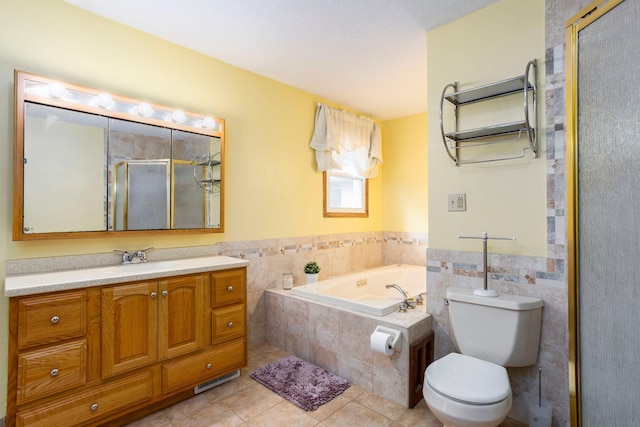 full bathroom featuring toilet, separate shower and tub, tile walls, vanity, and tile patterned flooring