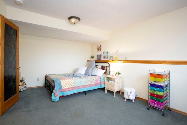 bedroom with dark colored carpet