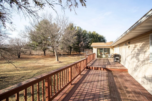 deck featuring a lawn