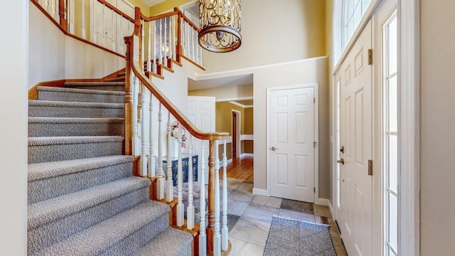 entrance foyer featuring a towering ceiling