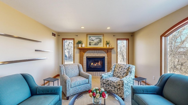 living area featuring a fireplace