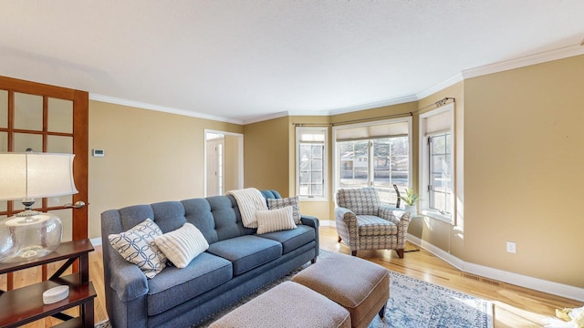 living room featuring hardwood / wood-style flooring and ornamental molding