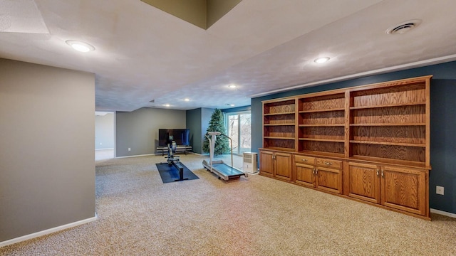 workout room featuring light colored carpet