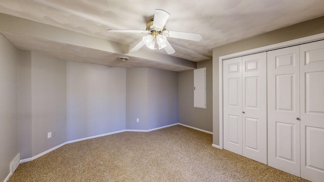 unfurnished bedroom with carpet floors, ceiling fan, and a closet