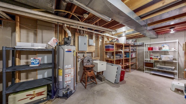 basement featuring electric panel and water heater