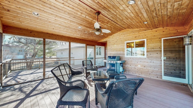 sunroom / solarium with wood ceiling, ceiling fan, and lofted ceiling