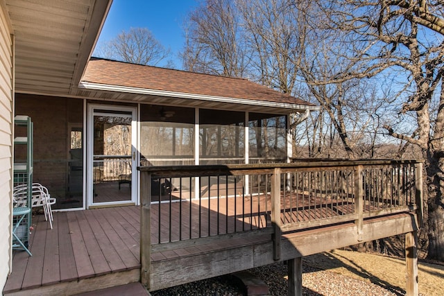 wooden deck featuring a sunroom