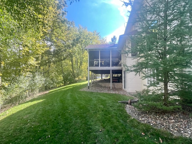 view of yard with a sunroom