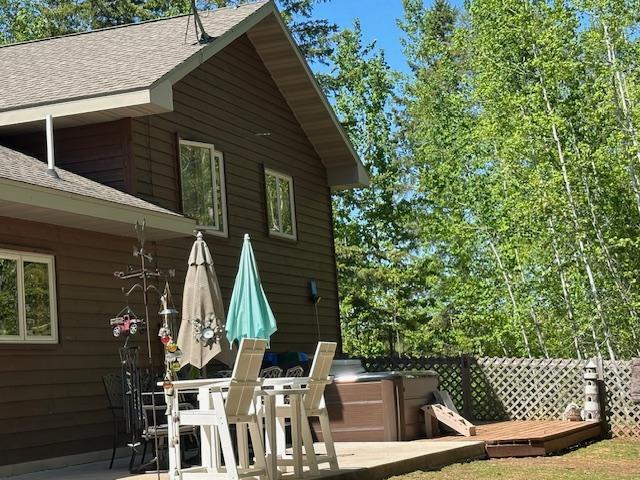112 Bay Rd, Coleraine, MN 55722 - wooden terrace featuring a patio area