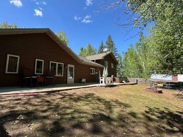 112 Bay Rd, Coleraine, MN 55722 - rear view of property featuring a patio