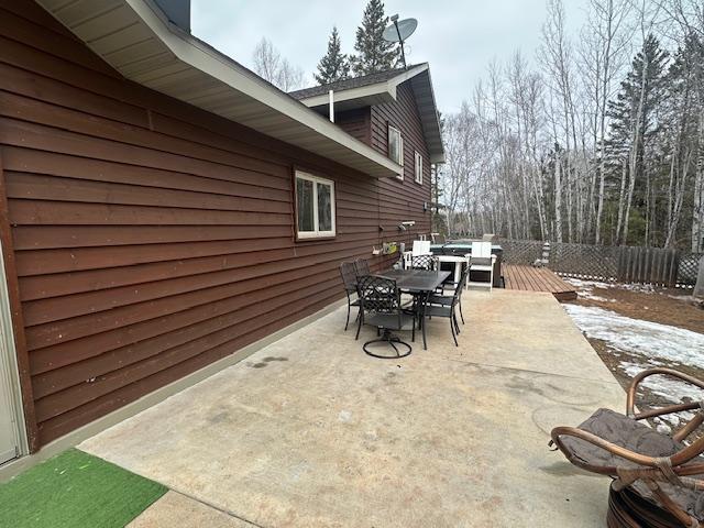 112 Bay Rd, Coleraine, MN 55722 - view of patio / terrace with outdoor dining space and a deck