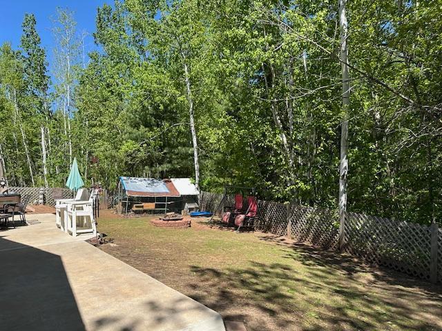 112 Bay Rd, Coleraine, MN 55722 - fenced backyard featuring a patio