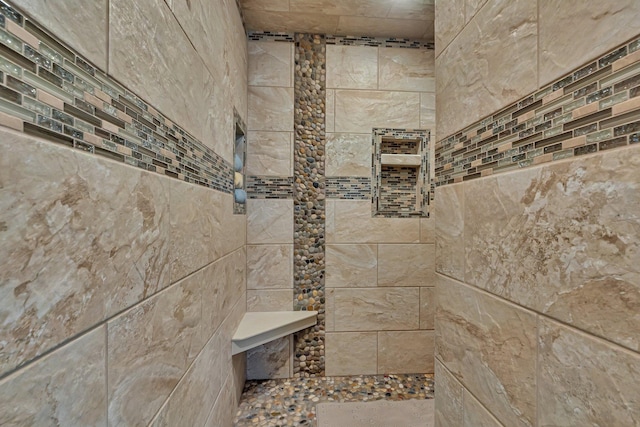 bathroom featuring tiled shower