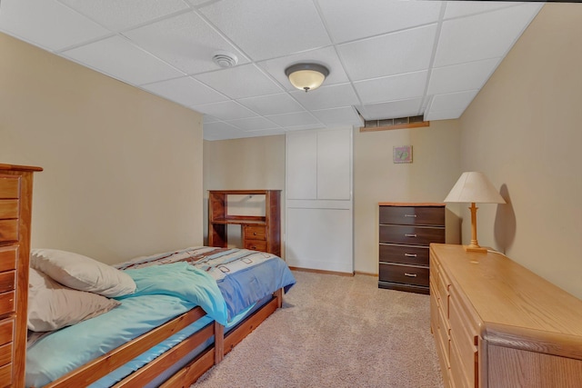 bedroom featuring a paneled ceiling