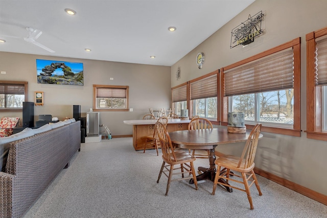 dining space with light colored carpet