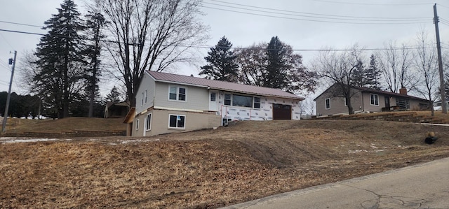 view of front of property featuring a garage