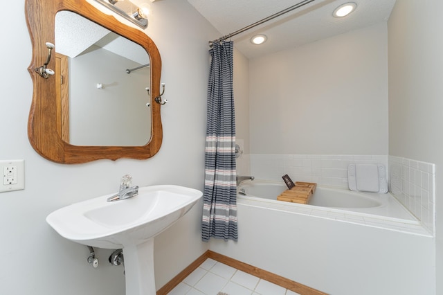 full bathroom featuring baseboards, tile patterned flooring, a garden tub, and recessed lighting