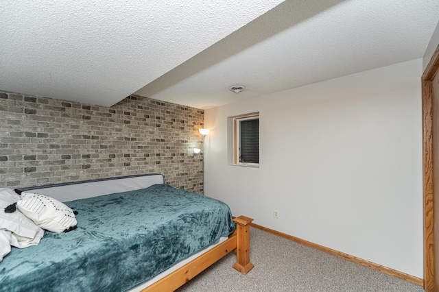 bedroom with a textured ceiling, carpet, visible vents, and baseboards