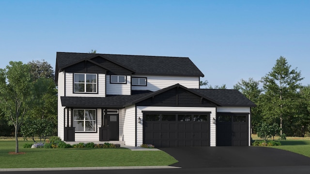 view of front of home with a garage and a front yard