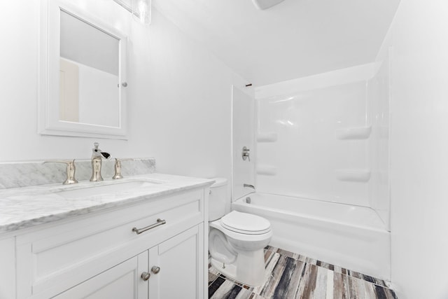 full bathroom featuring hardwood / wood-style flooring, shower / bathtub combination, vanity, and toilet