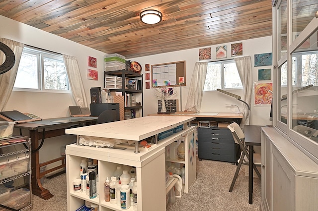 office space featuring light carpet, wood ceiling, and a workshop area