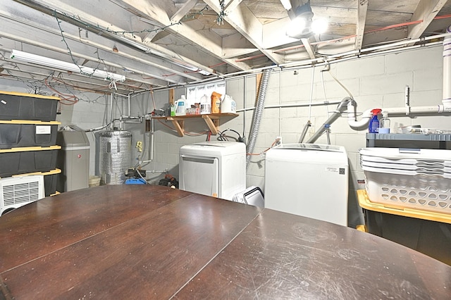 basement with water heater and fridge