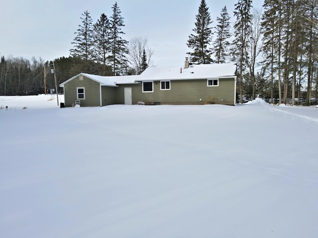 view of snow covered house