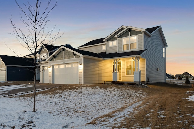 view of front of property featuring a garage and driveway