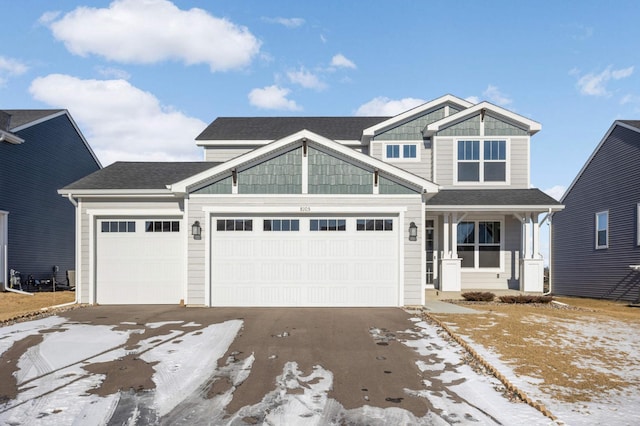 craftsman house with a garage