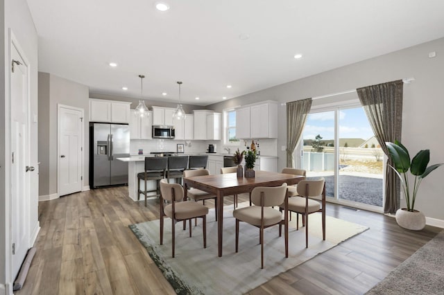 dining area with light hardwood / wood-style flooring