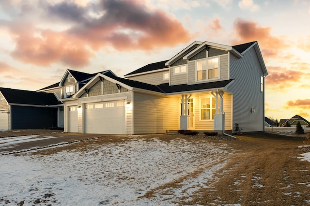 view of front of home with concrete driveway and a garage