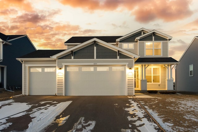 view of front of house with a garage and driveway