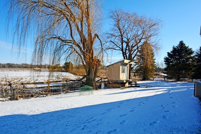 view of yard layered in snow