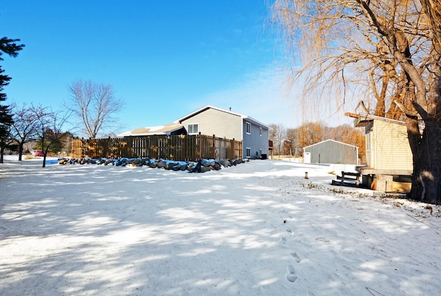 view of yard layered in snow