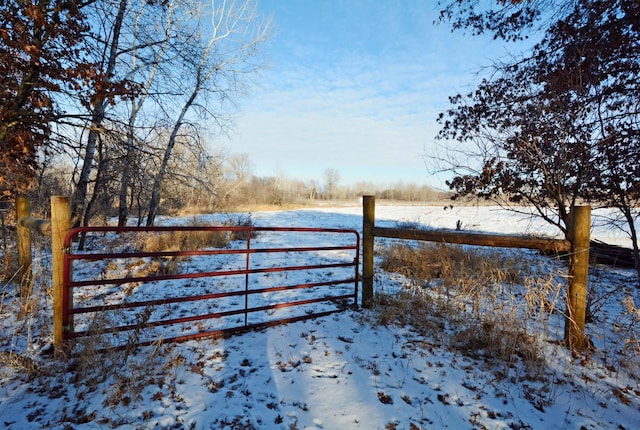 view of snow covered gate