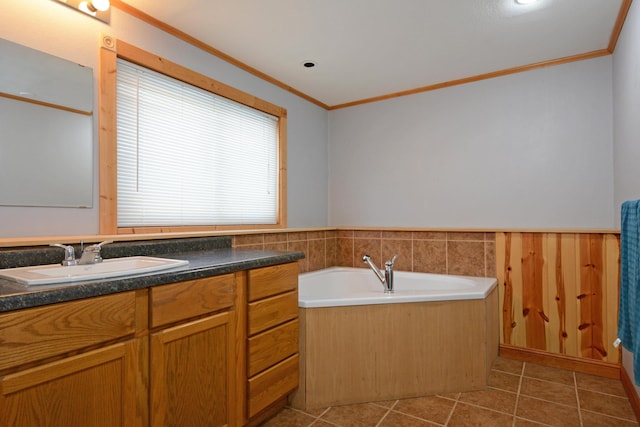 bathroom featuring vanity, a tub, tile patterned floors, and crown molding