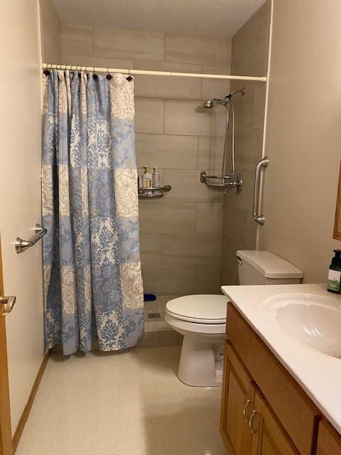 bathroom featuring vanity, toilet, and a shower with shower curtain