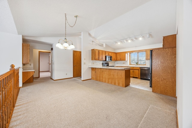 kitchen featuring lofted ceiling, light colored carpet, stainless steel appliances, a peninsula, and light countertops