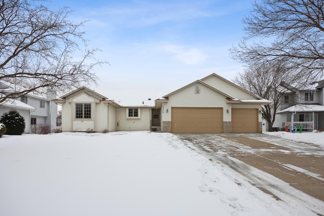 single story home featuring a garage, driveway, and brick siding