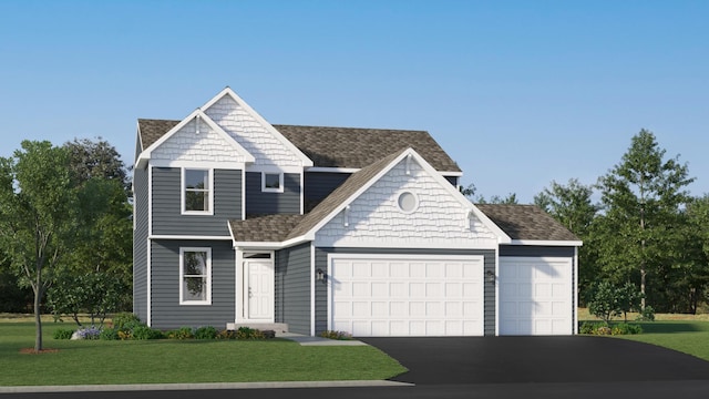 view of front of house featuring a garage and a front lawn