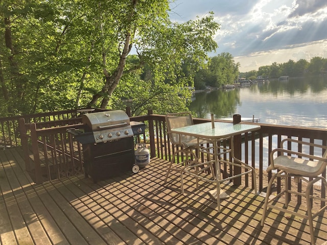 deck featuring grilling area and a water view