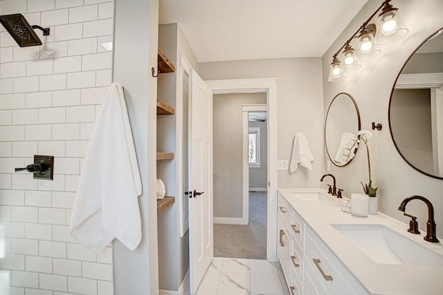 bathroom with vanity and a shower