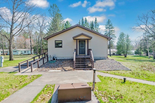 9505 Buskey Bay Dr, Iron River, WI 54847 - bungalow featuring a front yard