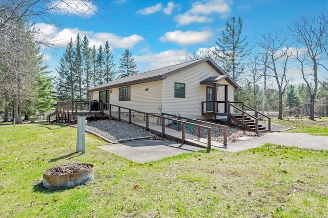 9505 Buskey Bay Dr, Iron River, WI 54847 - view of side of property featuring stairway, a wooden deck, a lawn, and a patio