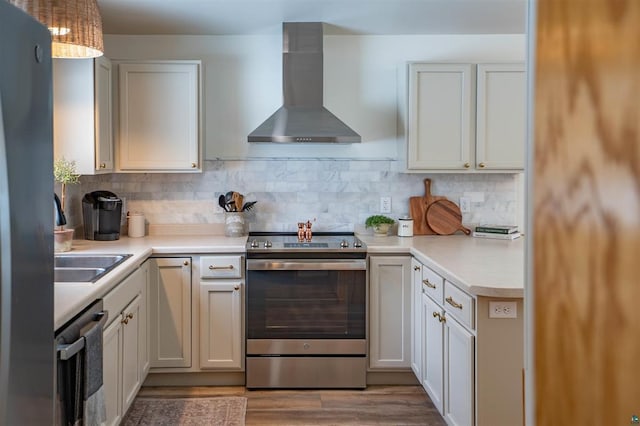 9505 Buskey Bay Dr, Iron River, WI 54847 - kitchen with stainless steel appliances, wall chimney exhaust hood, light countertops, and tasteful backsplash