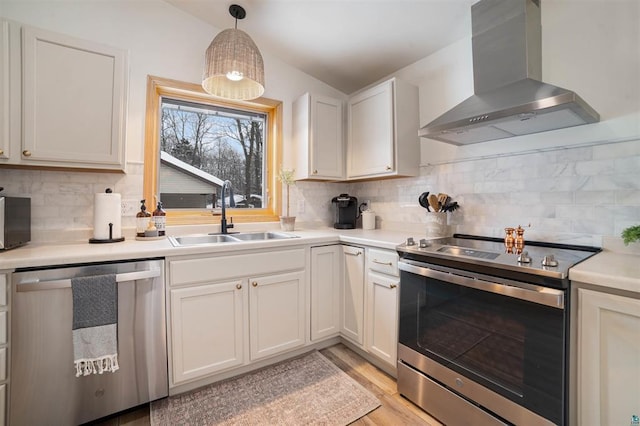 9505 Buskey Bay Dr, Iron River, WI 54847 - kitchen featuring stainless steel appliances, wall chimney exhaust hood, a sink, and tasteful backsplash