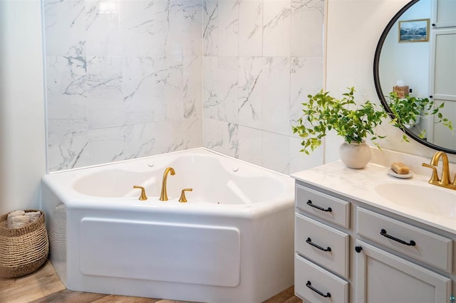 9505 Buskey Bay Dr, Iron River, WI 54847 - bathroom featuring a tub with jets and vanity