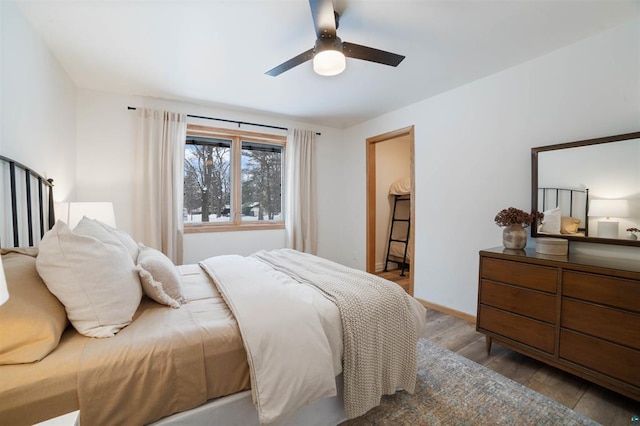 9505 Buskey Bay Dr, Iron River, WI 54847 - bedroom featuring wood finished floors, ceiling fan, and baseboards